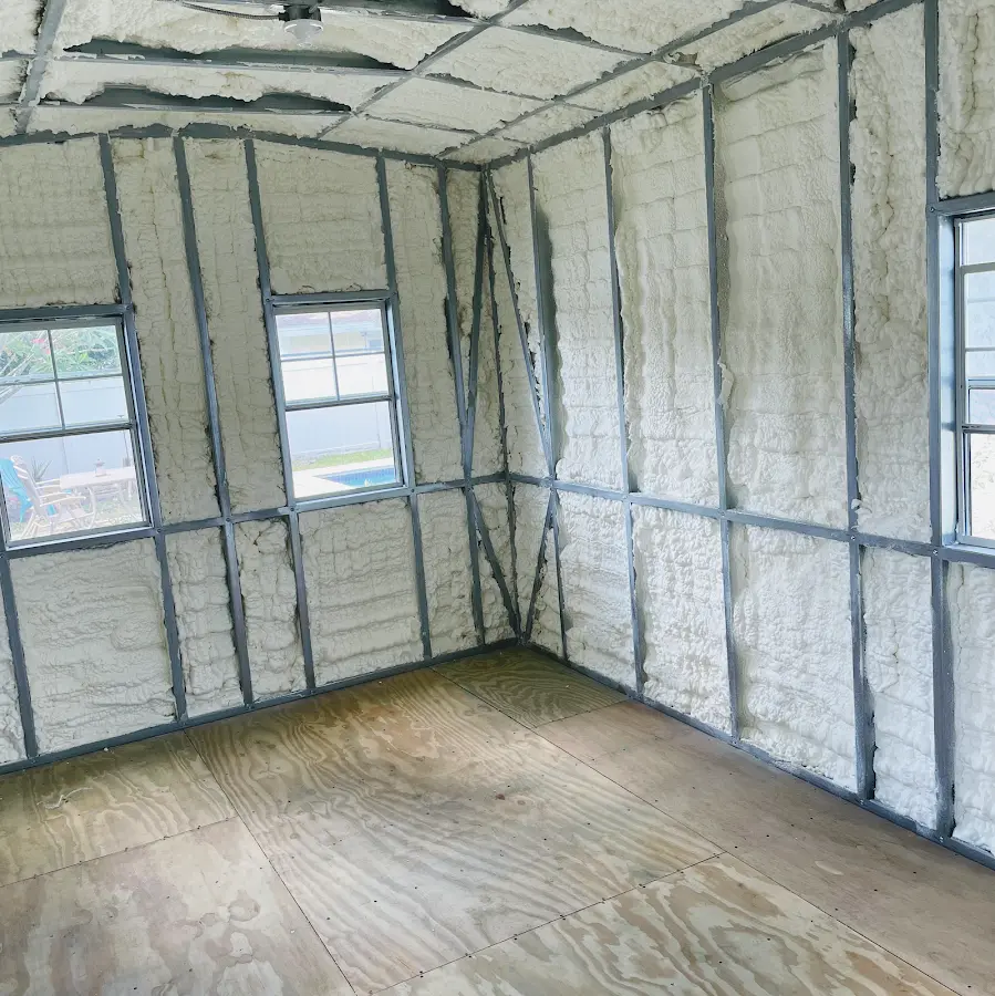 Closed-cell spray foam insulation applied to wall cavities in a residential project in Christiana